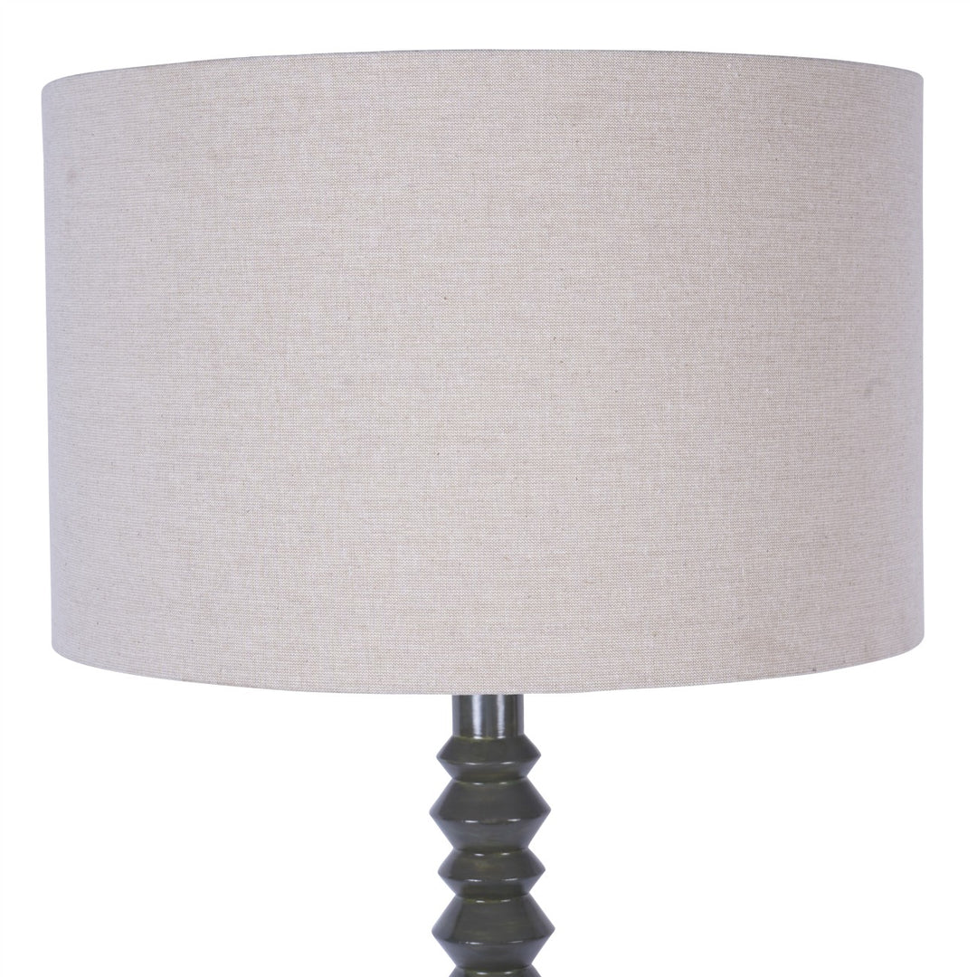 Lamp with a beige lampshade and olive base on a white background