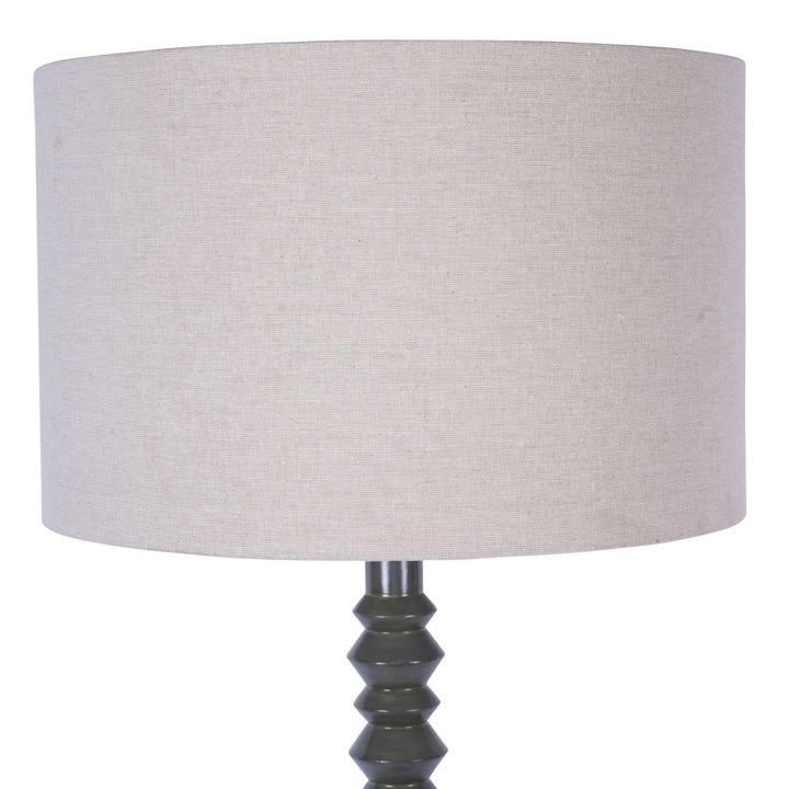Lamp with a beige lampshade and olive base on a white background