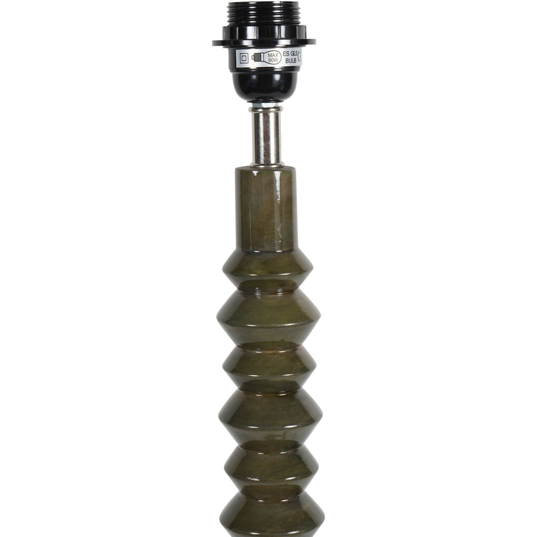 Decorative lamp base with a textured design on a white background