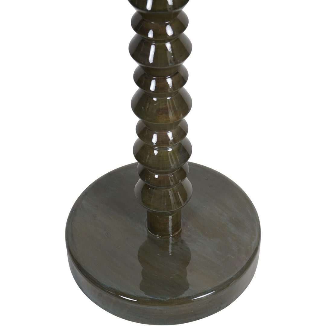 Olive candle holder with spiral design on a white background