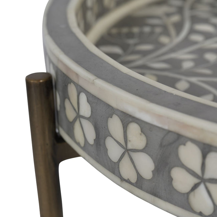 Decorative round table with floral pattern on a white background