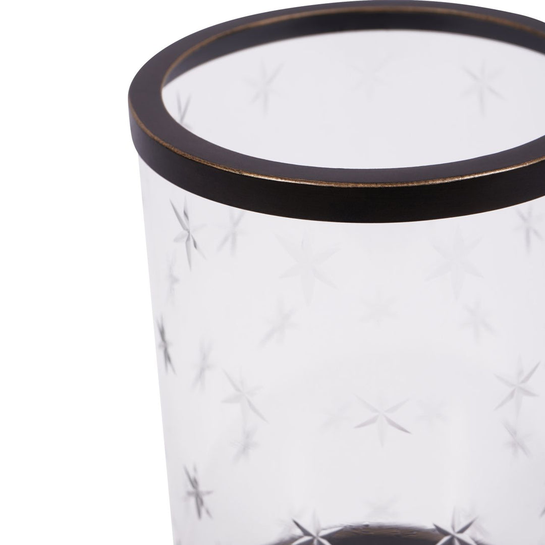 Clear glass vase with black rim on a white background