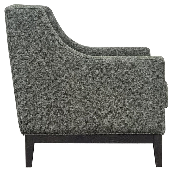 Forest green upholstered armchair on a white background
