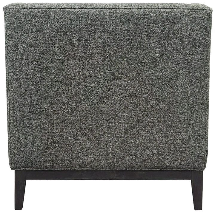 Forest green upholstered chair with wooden legs on a white background