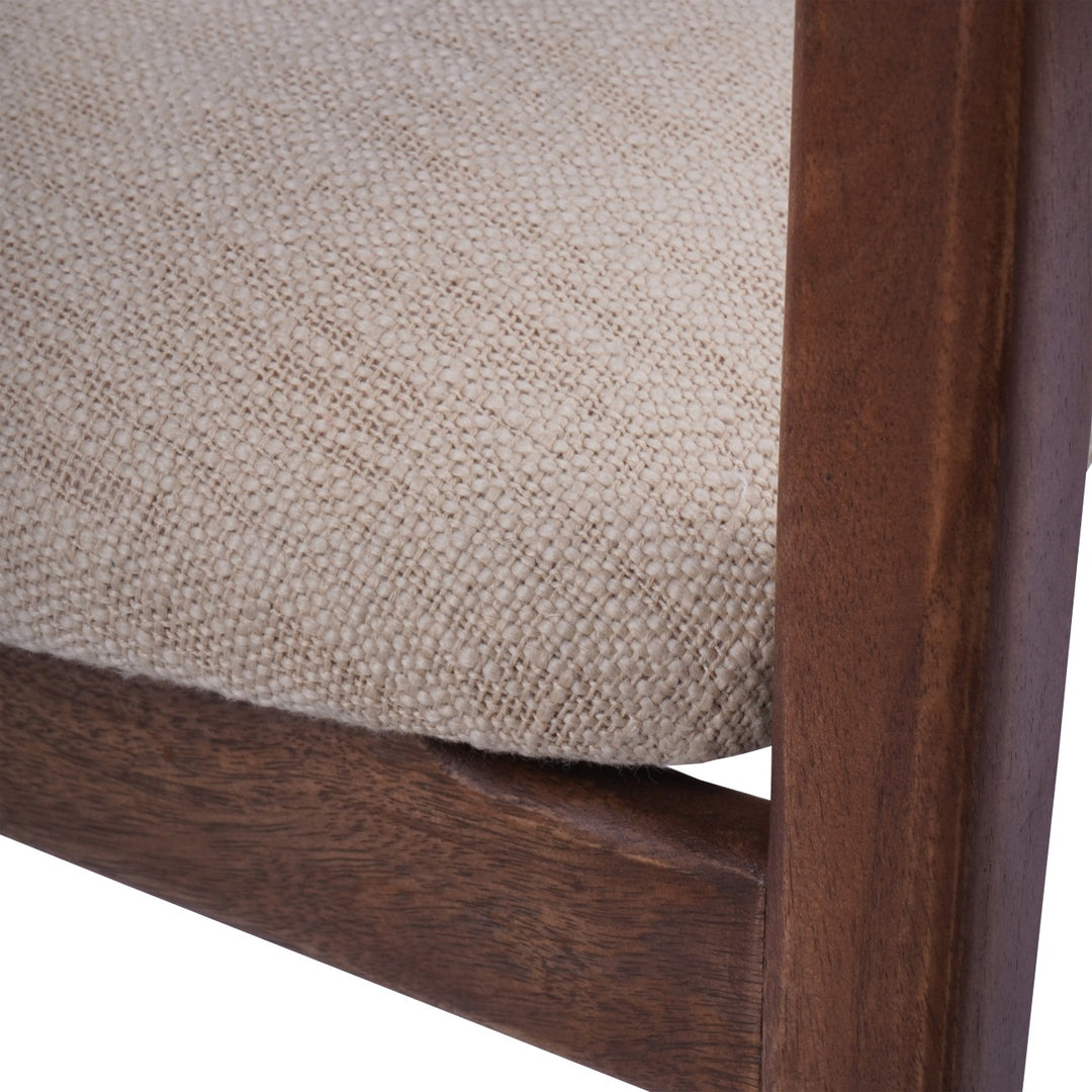 Close-up of a chair with wooden frame and beige fabric seat.
