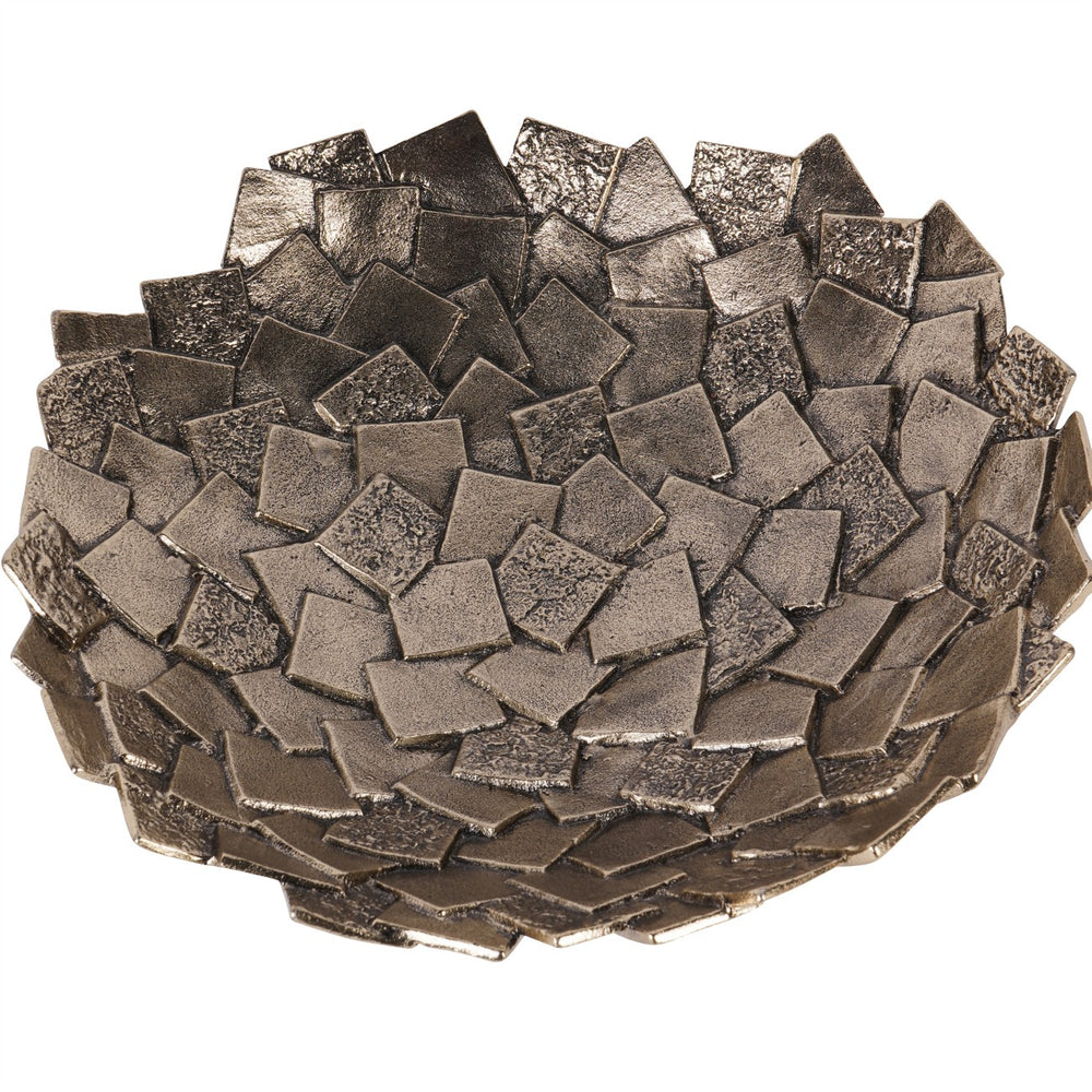 Decorative bowl made of metallic square tiles on a white background