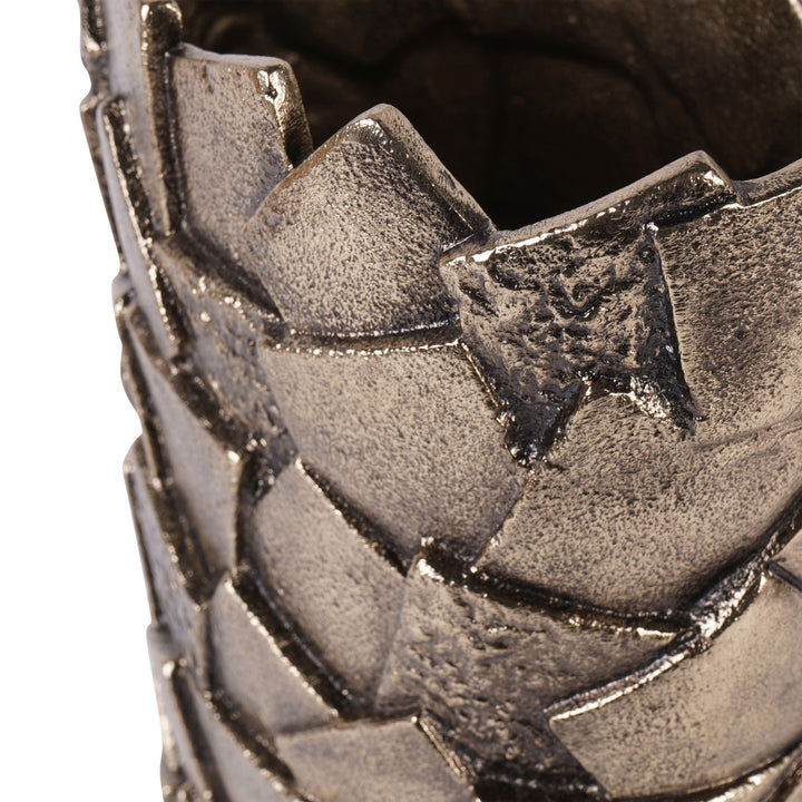 Close-up of a textured metallic object with star design