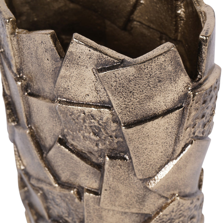 Close-up of a textured metallic object with geometric patterns