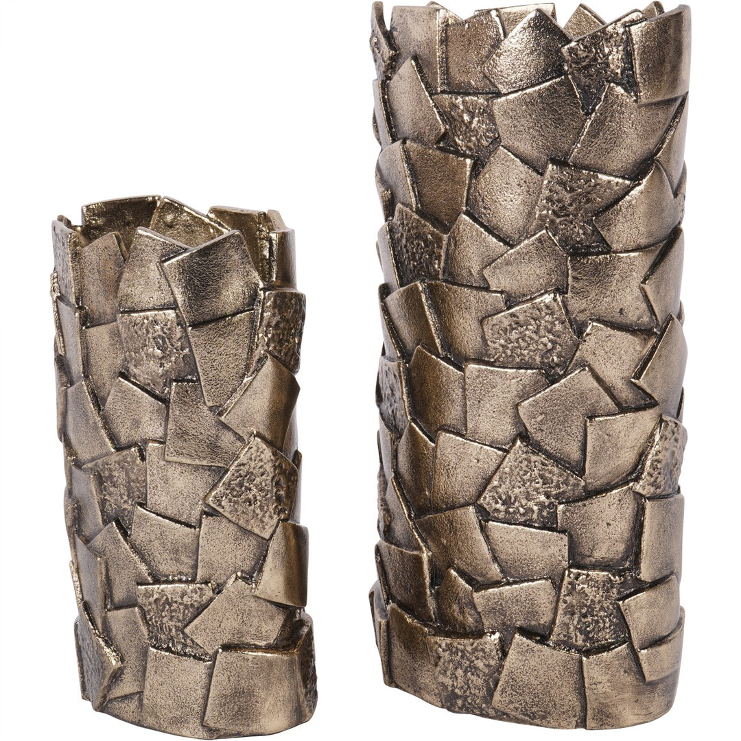 Two metallic candle holders with textured, woven design on a white background