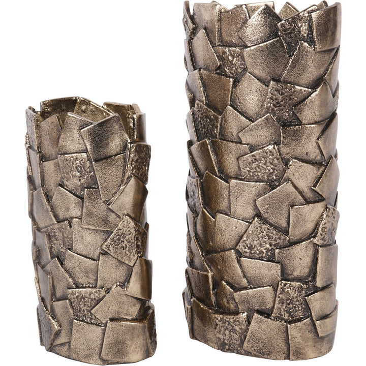 Two metallic candle holders with textured, woven design on a white background