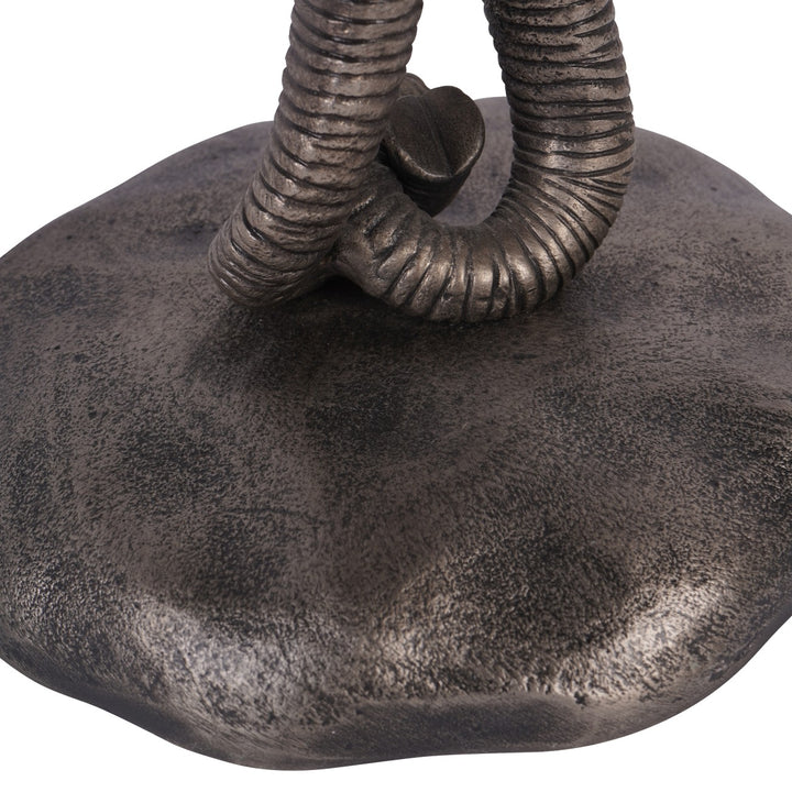 Bronze elephant statue with detailed trunk on a white background
