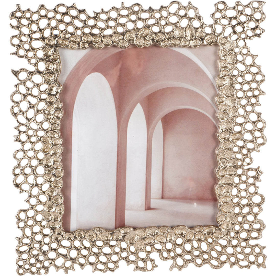 Decorative photo frame with intricate design on a white background