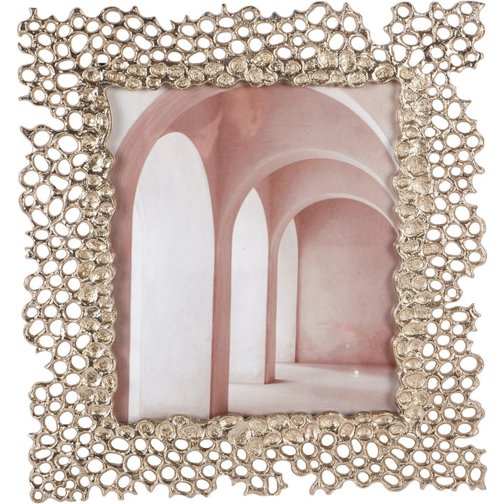 Decorative photo frame with intricate design on a white background