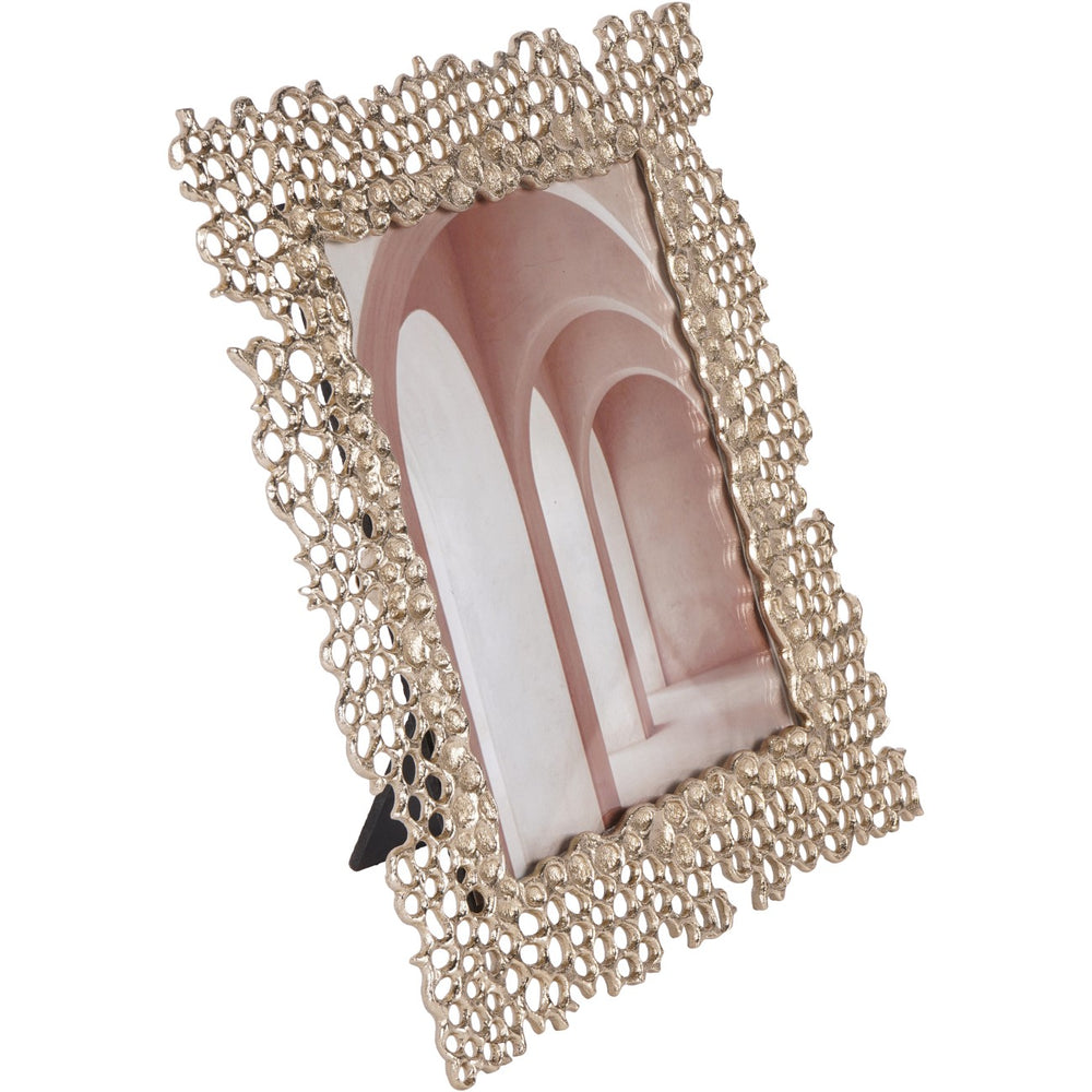 Decorative photo frame with intricate design on a white background