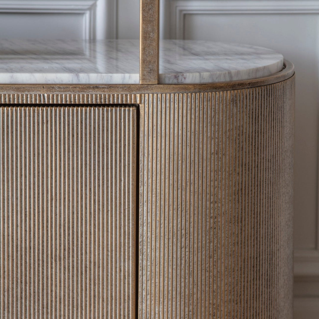Close-up of a wooden cabinet with marble countertop