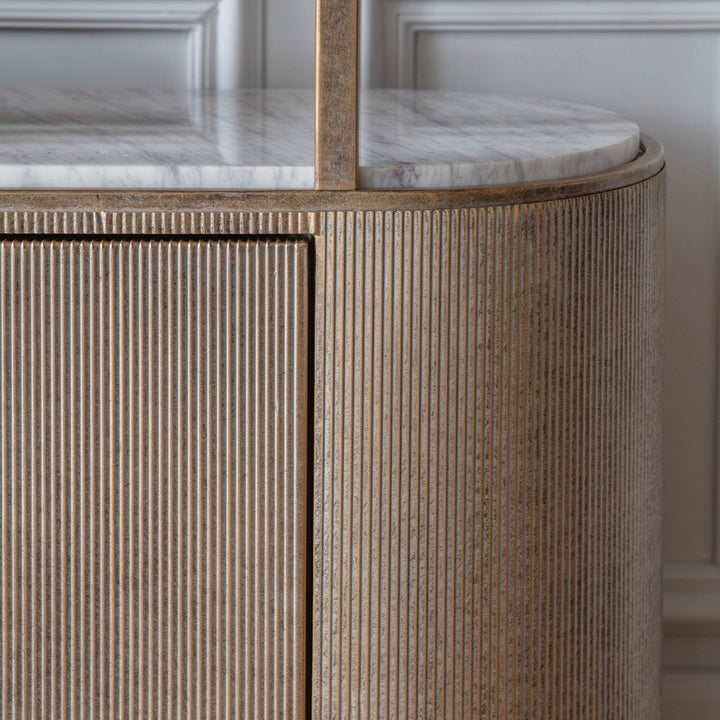 Close-up of a wooden cabinet with marble countertop