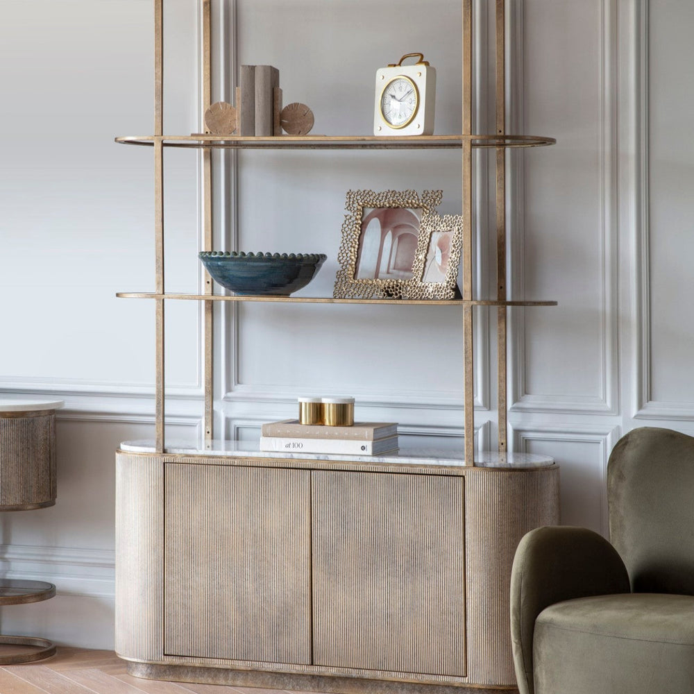 Modern interior with a stylish bookshelf and armchair.