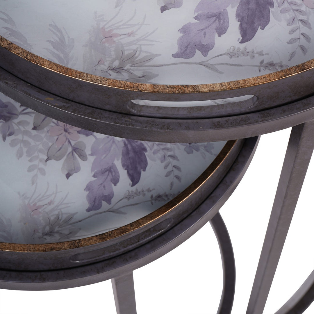 Stack of round trays with floral pattern on a white background