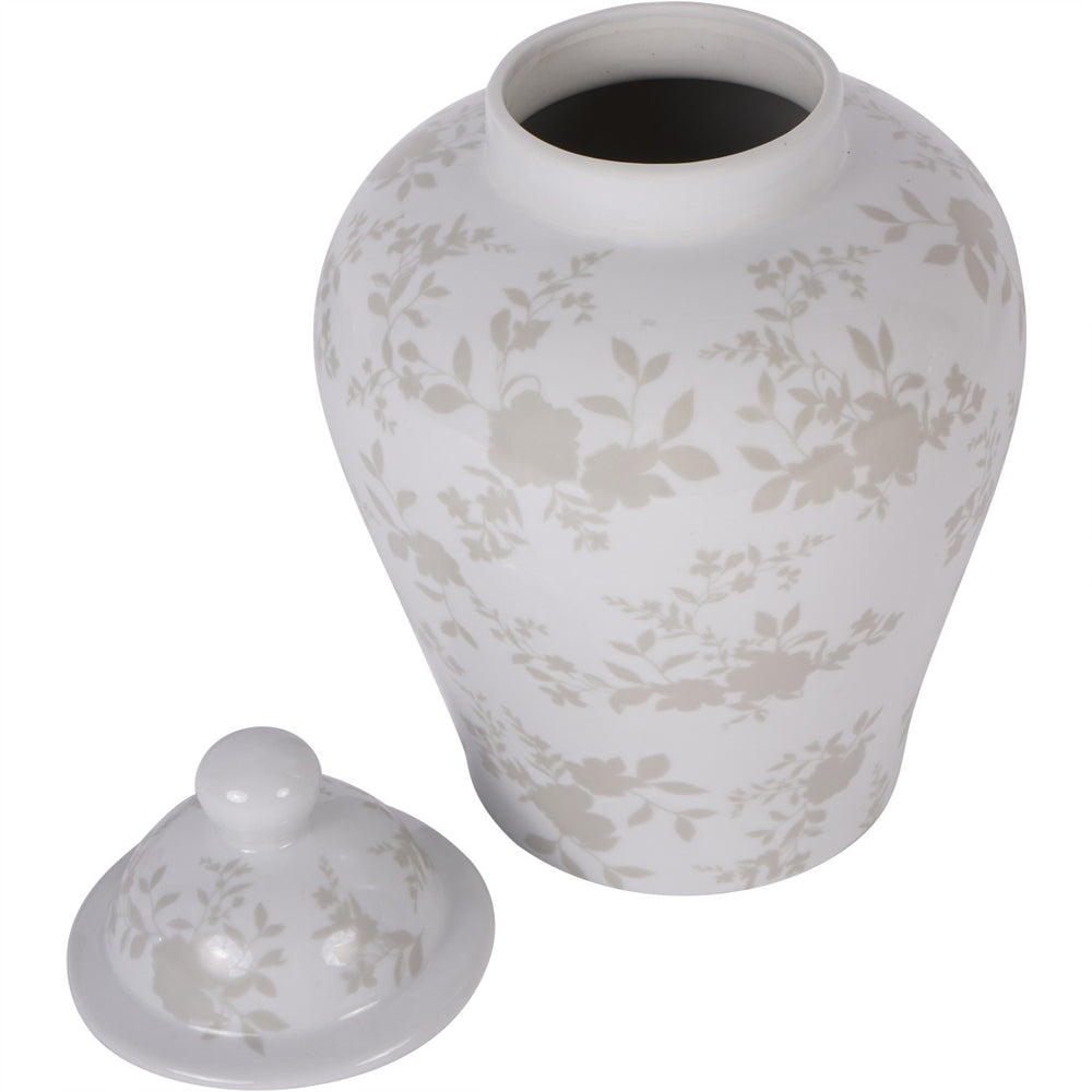 White ceramic urn with floral patterns and matching lid on a white background