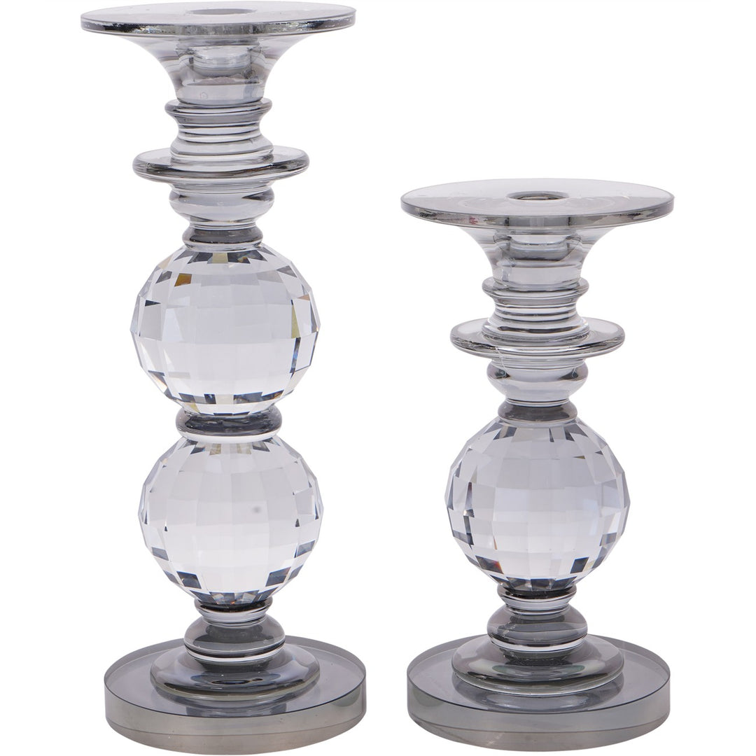 Two crystal candle holders on a white background
