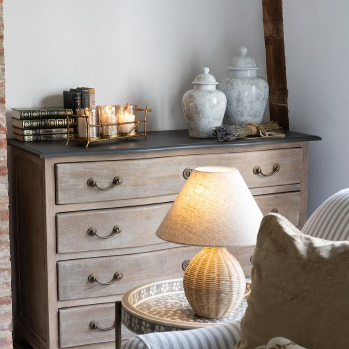 Napoleon Chateau bedroom furniture set with chest of drawers, ottoman, and lamp.