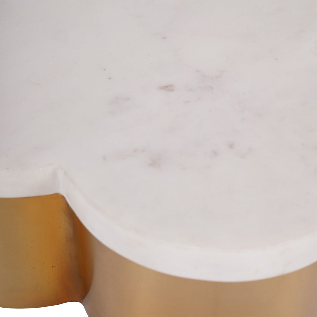 Close-up of a decorative box with marbled top and gold cylindrical base on a white background