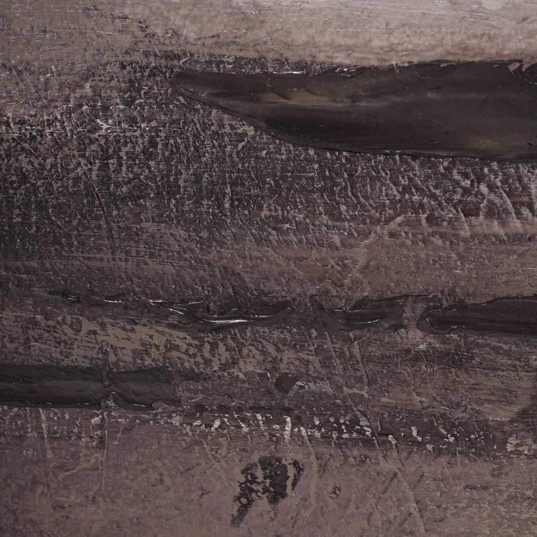 Close-up of a textured stone surface with patterns and variations in color.