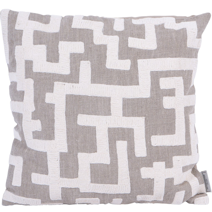 Decorative cushion with geometric pattern on a plain background