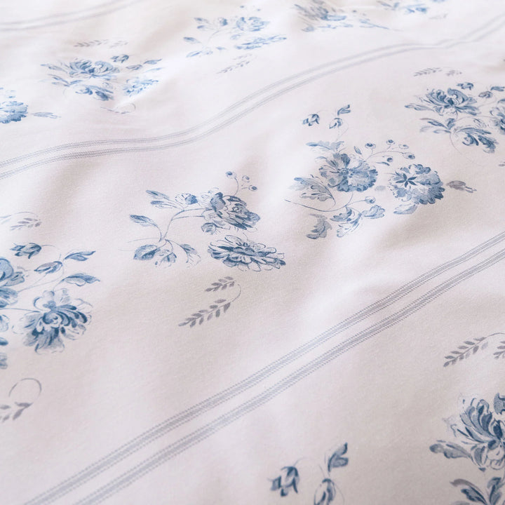 Close-up of white fabric with blue floral patterns