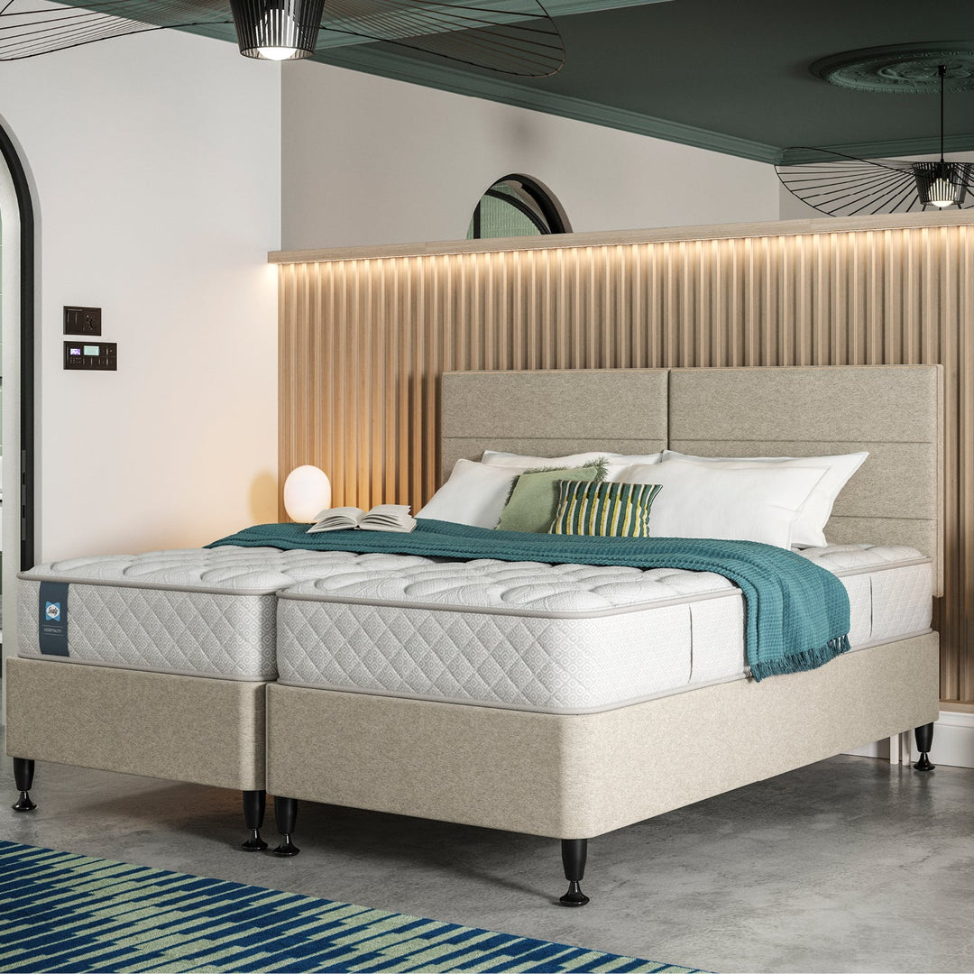Hotel bedroom with a Sealy Duke hospitality mattress and decorative elements
