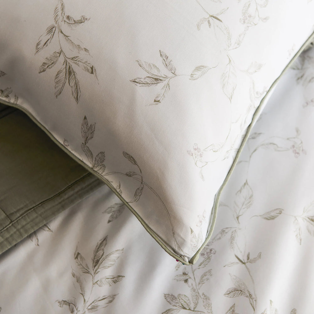 Floral-patterned fabric with a green border on a neutral background