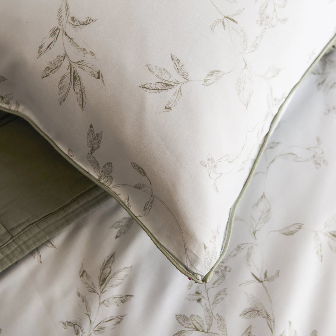 Floral-patterned fabric with a green border on a neutral background