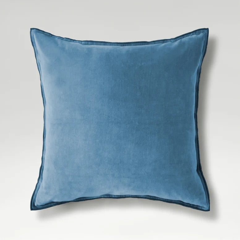 Blue pillow on a light gray background