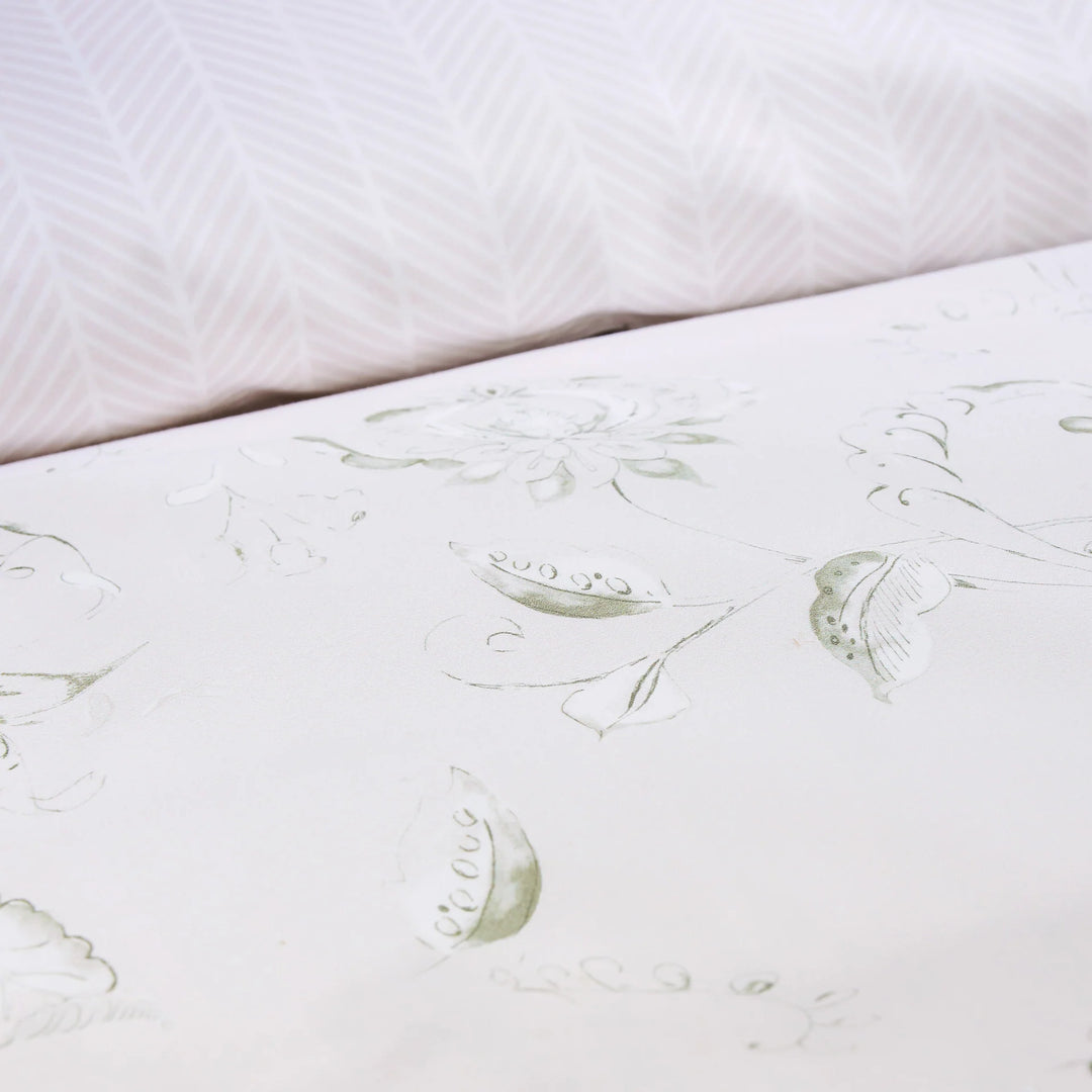 Close-up of a mattress with floral patterns on a white background
