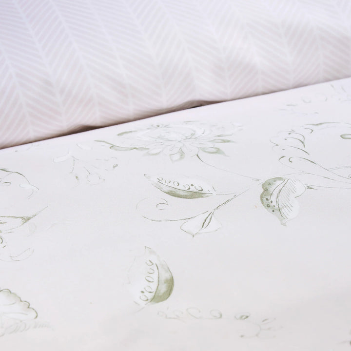 Close-up of a mattress with floral patterns on a white background