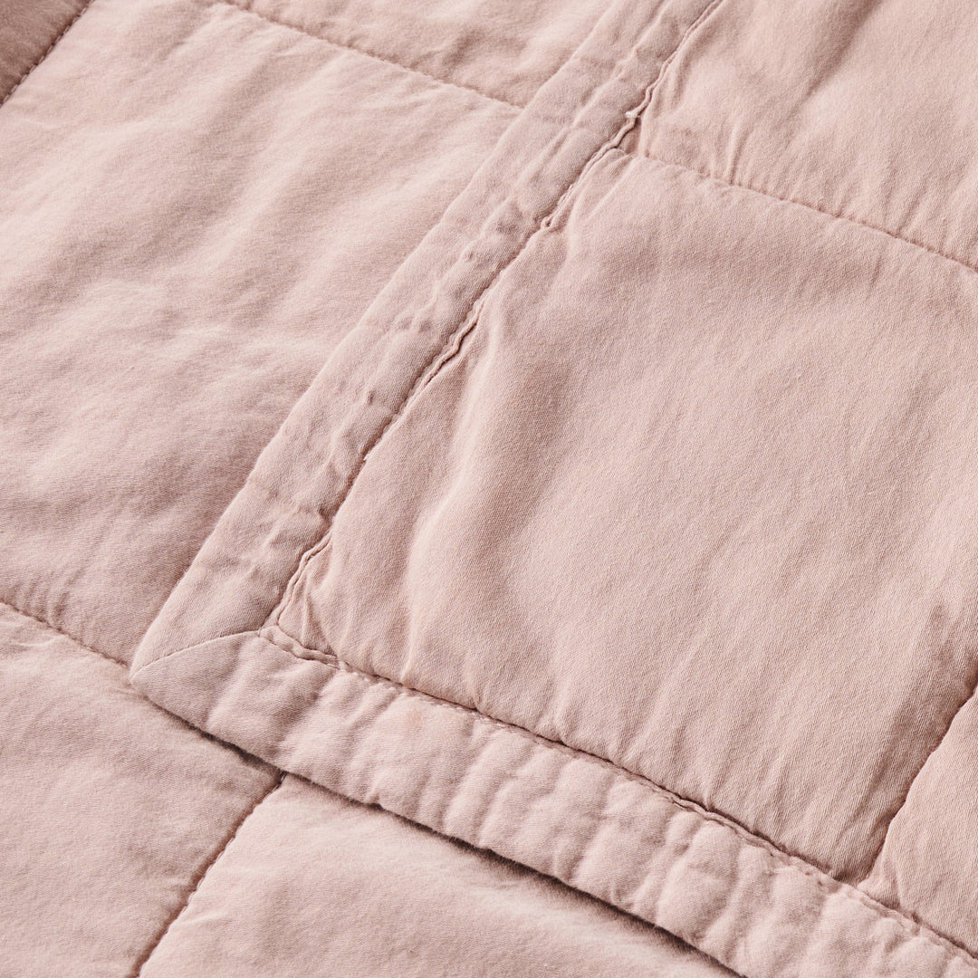 Close-up of a pink quilted fabric texture