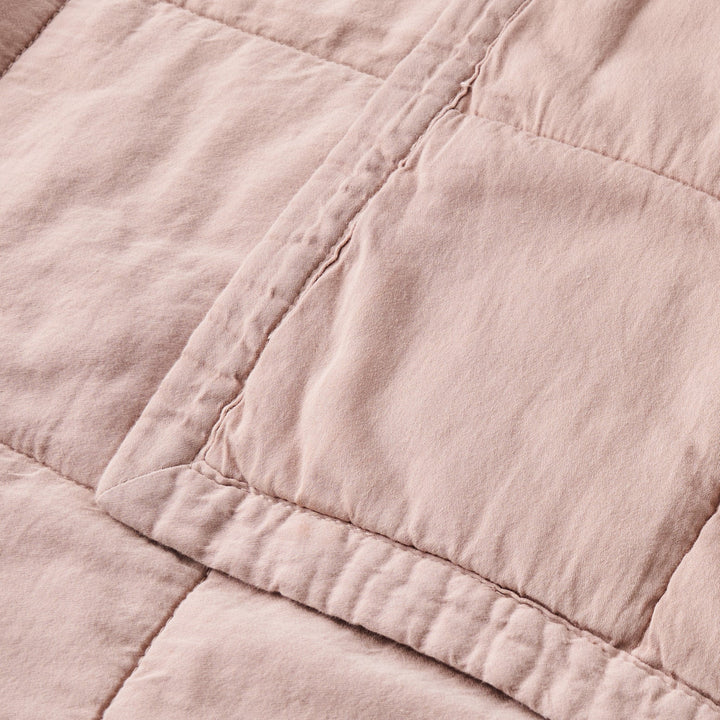 Close-up of a pink quilted fabric texture