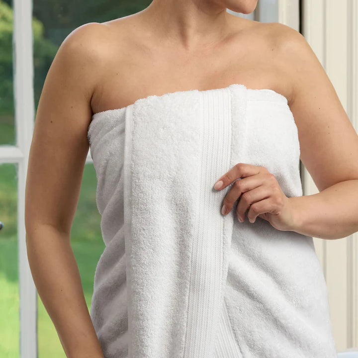 Person wrapped in CHRISTY Supreme Hygro Towels - White