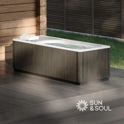 Outdoor cold plunge on a wooden deck with 'Sun & Soul' branding.